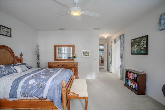 bedroom featuring ceiling fan and light carpet