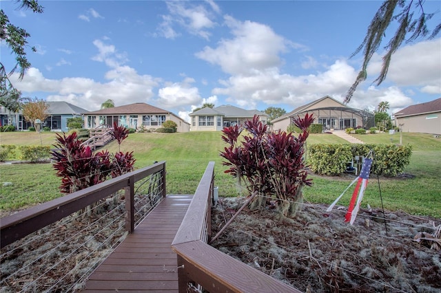 view of dock with a yard