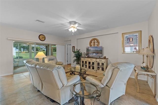 tiled living room featuring ceiling fan