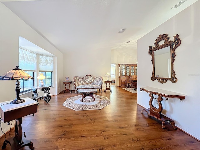 sitting room with dark hardwood / wood-style floors