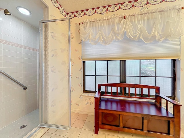 bathroom with tile patterned flooring and an enclosed shower