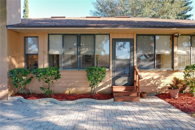 doorway to property featuring a patio