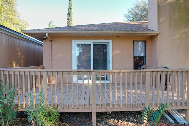 rear view of house featuring a deck