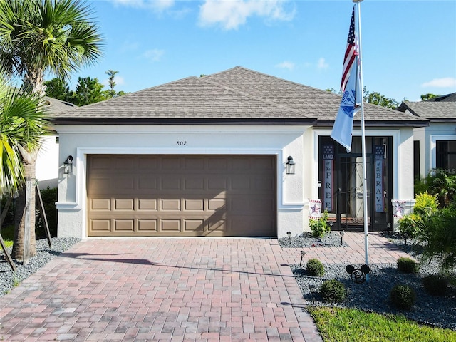 ranch-style house featuring a garage