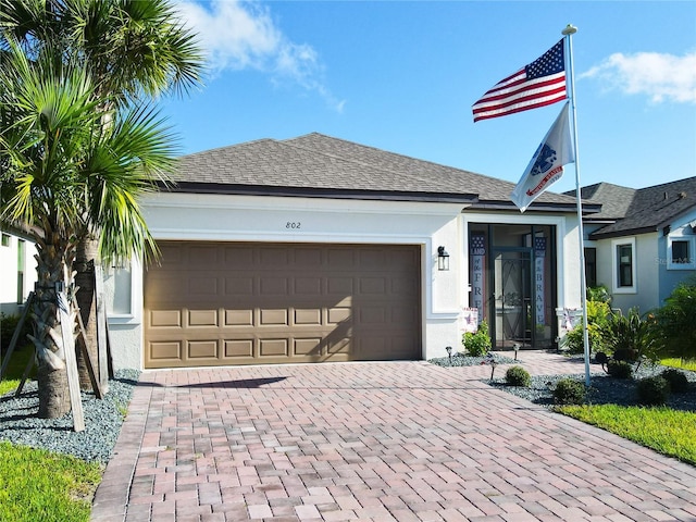 ranch-style home featuring a garage