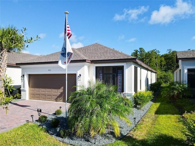 view of front of property with a front lawn and a garage