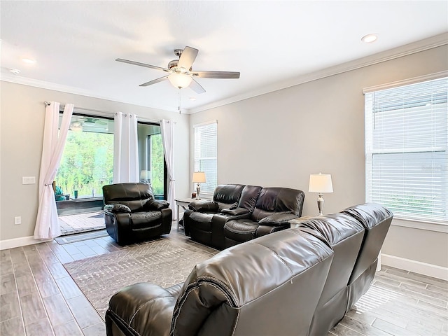 living room with ceiling fan, light hardwood / wood-style flooring, and crown molding