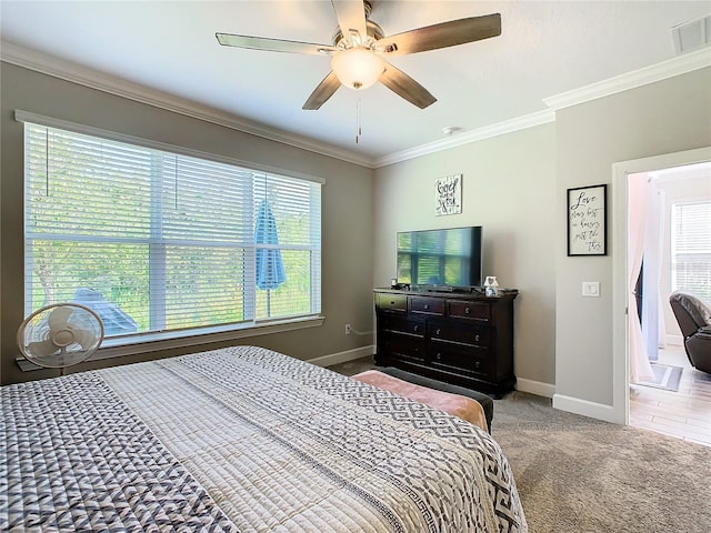 bedroom featuring carpet, multiple windows, crown molding, and ceiling fan