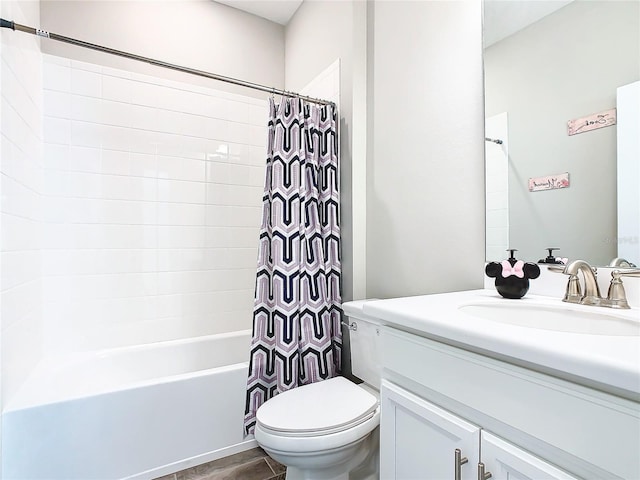 full bathroom featuring vanity, toilet, and shower / tub combo with curtain