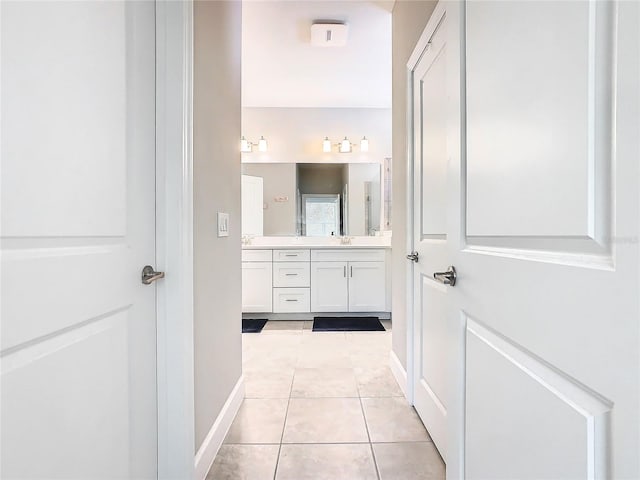 bathroom with vanity and tile patterned floors