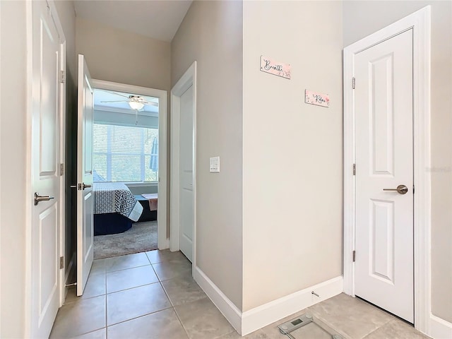 corridor with light tile patterned flooring