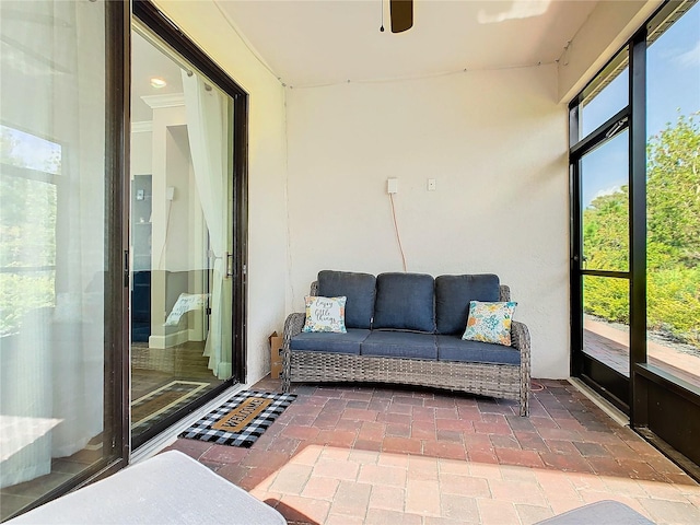 sunroom with ceiling fan