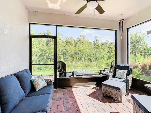 sunroom / solarium with plenty of natural light and ceiling fan