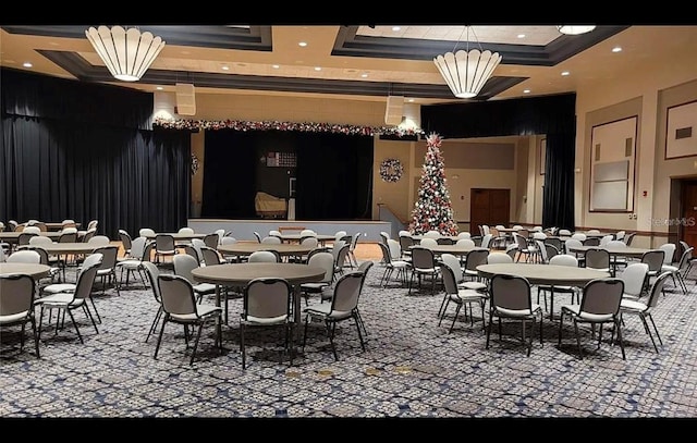 dining area featuring a raised ceiling