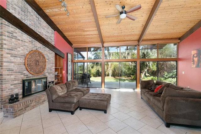 living room featuring beam ceiling, plenty of natural light, and wood ceiling