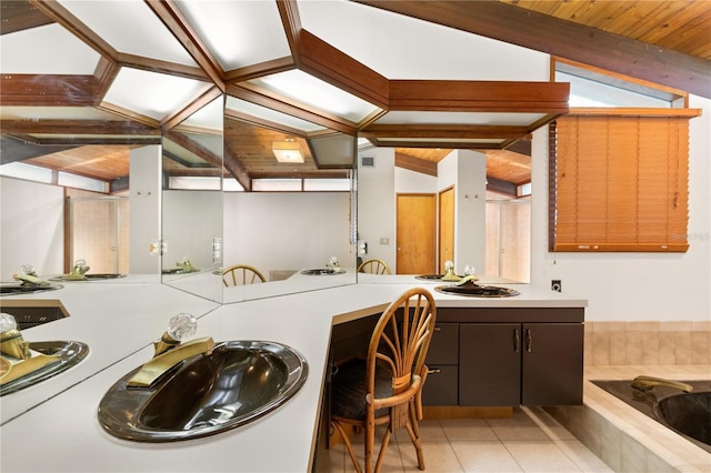 laundry area featuring sink and light tile patterned floors