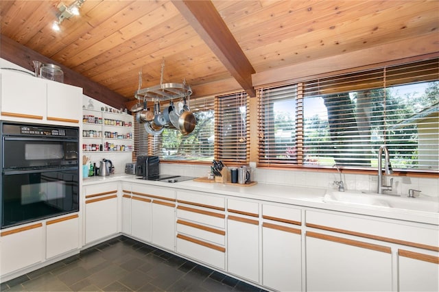 kitchen with wood ceiling, sink, black appliances, white cabinetry, and lofted ceiling