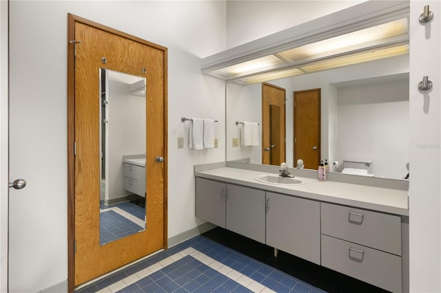 bathroom featuring tile patterned floors and vanity