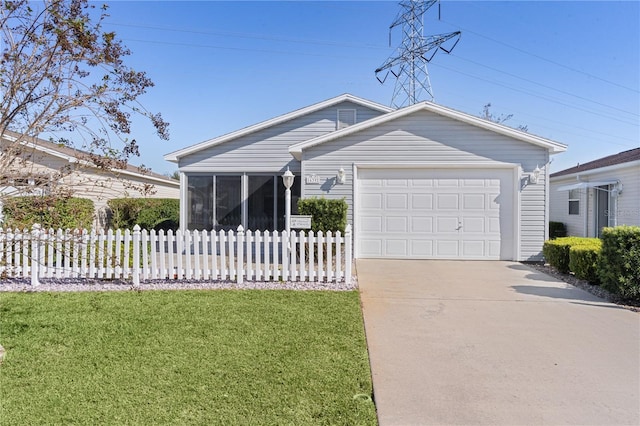 ranch-style house featuring a garage, a sunroom, and a front yard