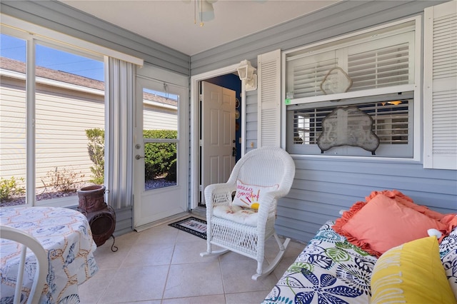 sunroom / solarium with ceiling fan