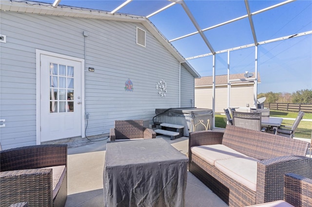 view of patio / terrace with a hot tub