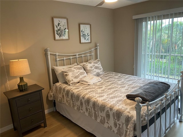 bedroom featuring ceiling fan and light hardwood / wood-style flooring