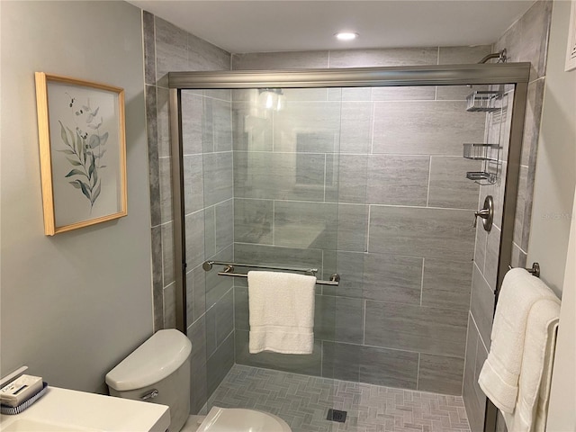 bathroom featuring toilet and walk in shower