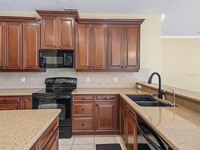 kitchen featuring decorative backsplash, crown molding, sink, black appliances, and light tile patterned flooring