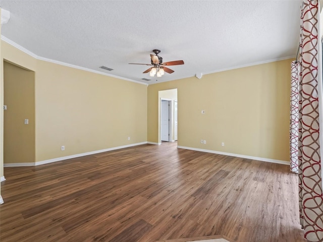 spare room with crown molding, wood-type flooring, and a textured ceiling