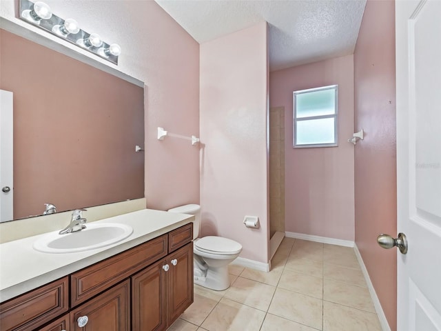 bathroom with walk in shower, tile patterned floors, a textured ceiling, toilet, and vanity