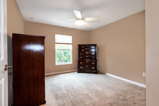 unfurnished bedroom featuring ceiling fan and light carpet