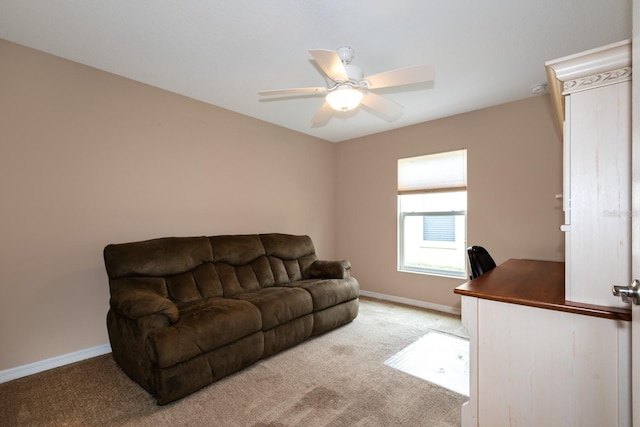 carpeted living room featuring ceiling fan