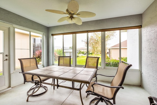 sunroom / solarium with ceiling fan