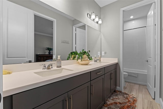 full bathroom with vanity,  shower combination, toilet, and crown molding