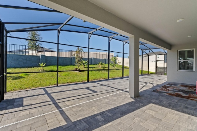 view of patio / terrace featuring a lanai