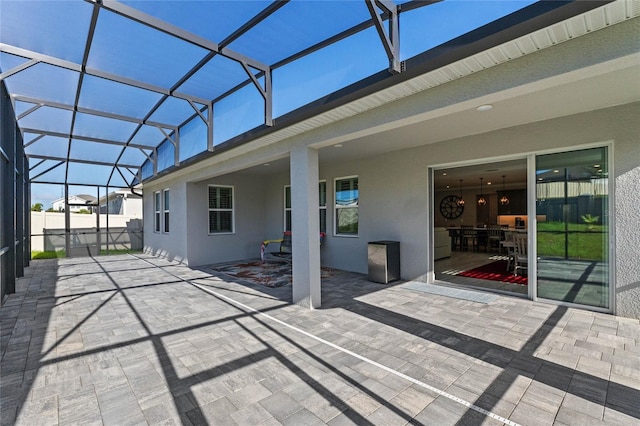 view of patio with a lanai