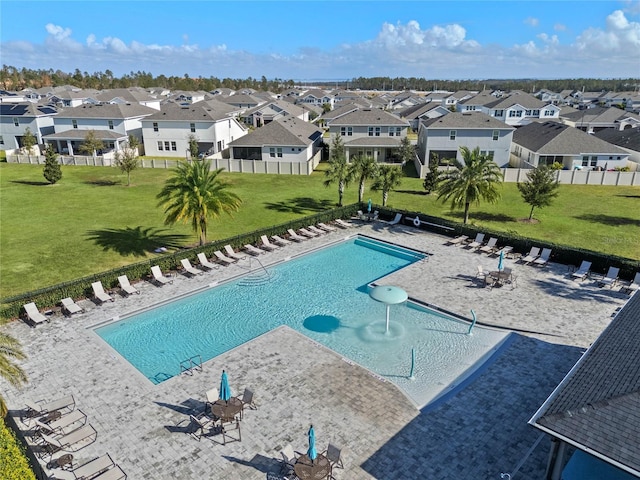 view of swimming pool with a lawn and a patio area