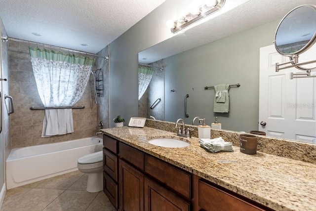 full bathroom with tiled shower / bath combo, tile patterned floors, a textured ceiling, toilet, and vanity