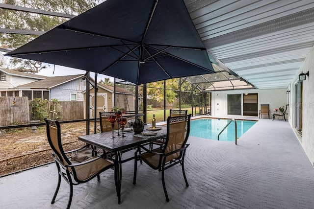 view of pool featuring a storage unit and a patio