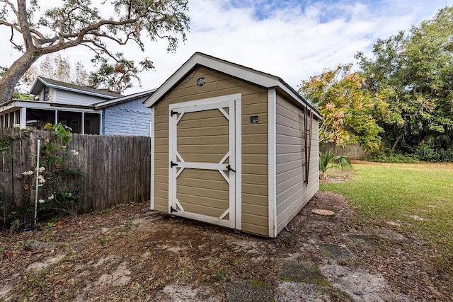 view of outdoor structure with a lawn