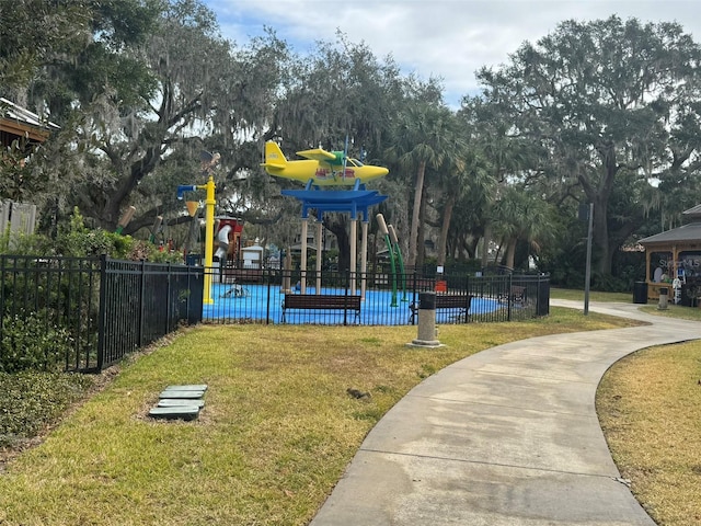 view of community with a playground and a yard