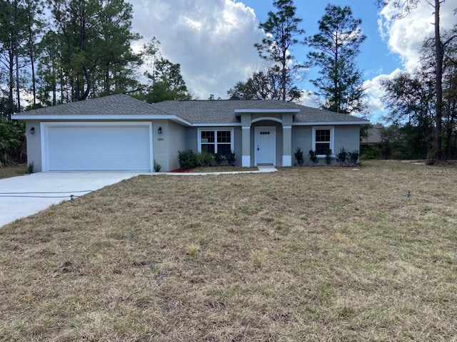 ranch-style home with a garage and a front yard