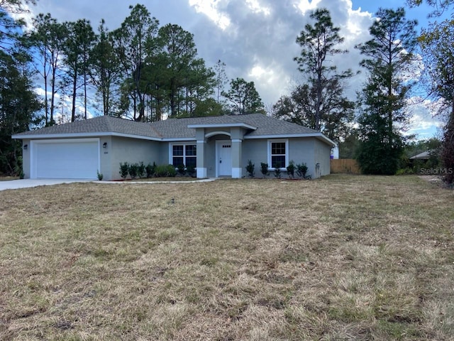 ranch-style house with a front yard and a garage