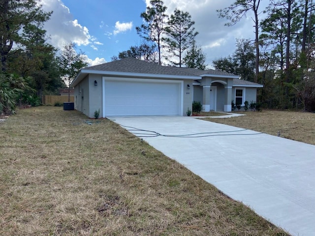 single story home with a front yard and a garage