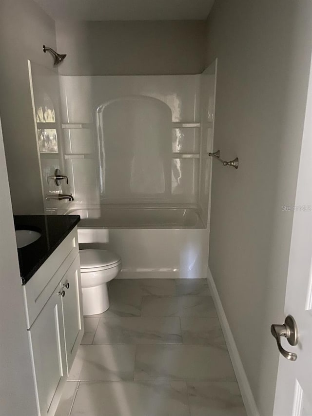 full bathroom featuring vanity, shower / bath combination, and toilet