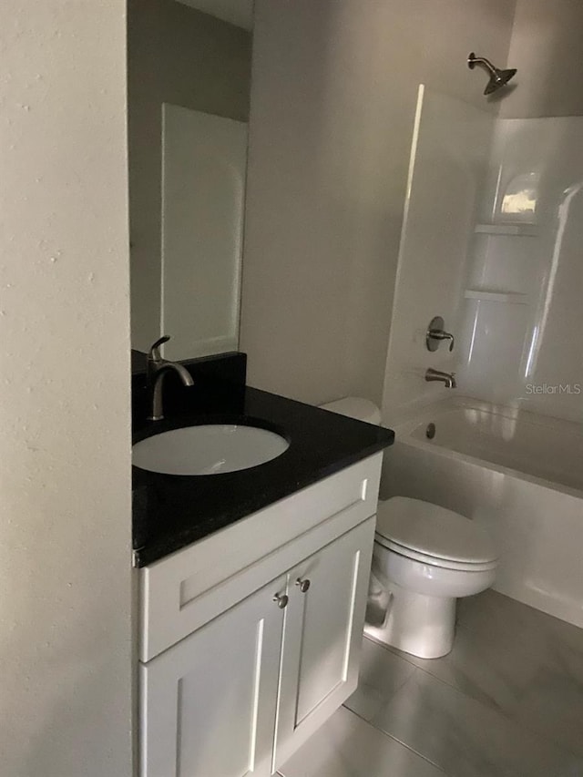 full bathroom with tile patterned floors, vanity, shower / bathing tub combination, and toilet