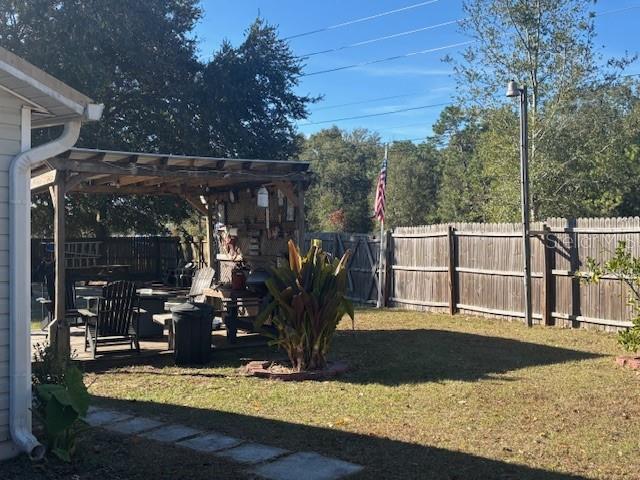 view of yard with a pergola