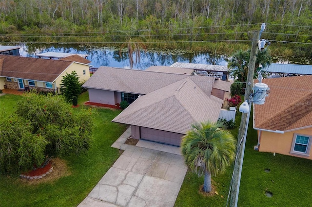 birds eye view of property with a water view