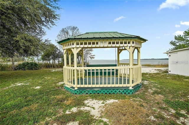 view of yard with a gazebo and a water view