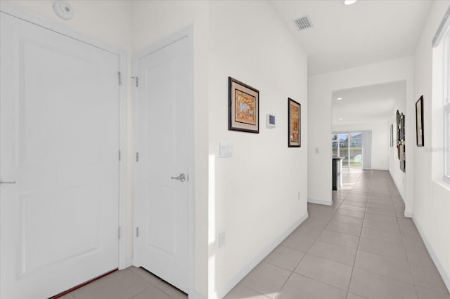 hallway featuring light tile patterned flooring